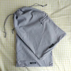 Gray Miu Miu dust bag set